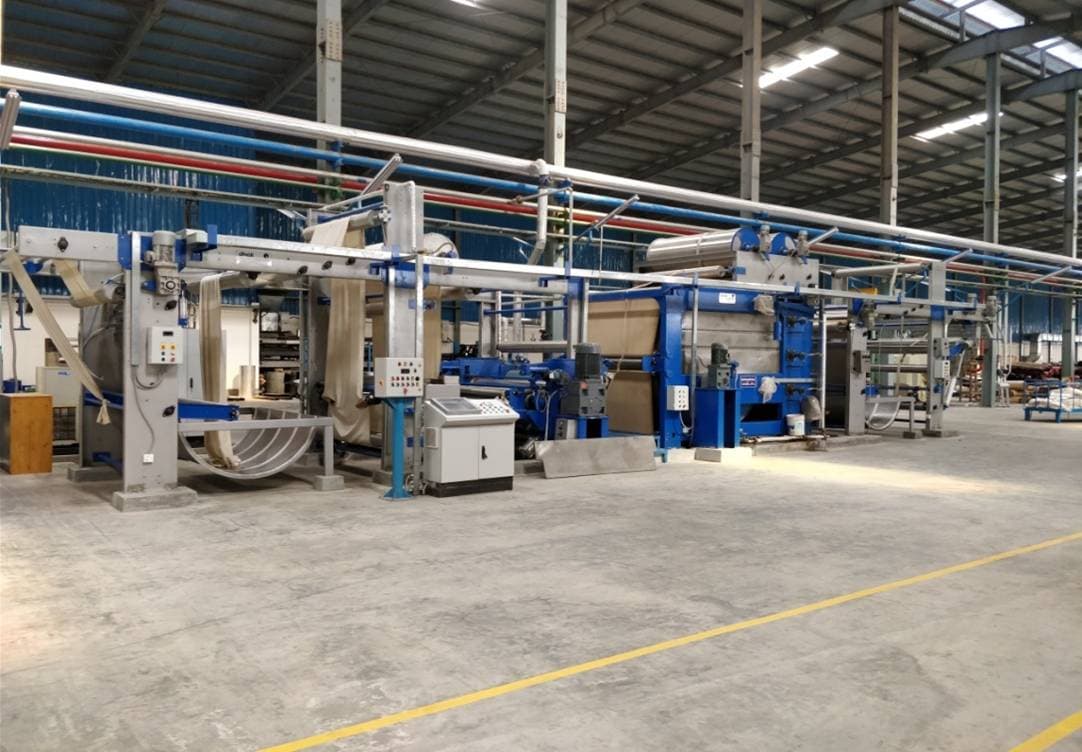 Continuous Shrinking Range machine in operation on the factory floor