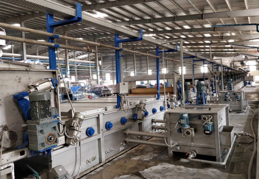 Continuous Mercerizing Range machine in operation on the factory floor